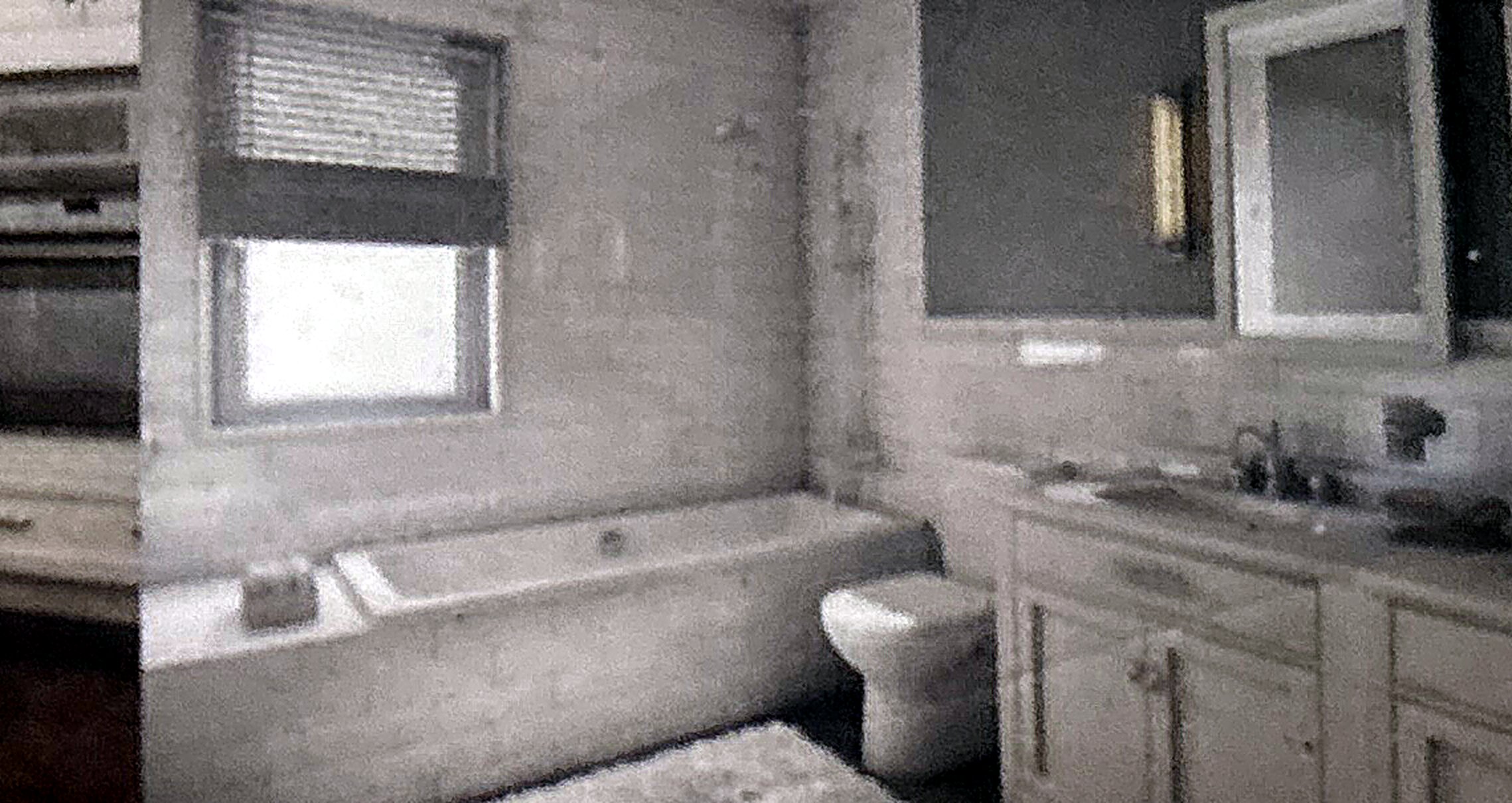 Remodeled bathroom with soaking tub and vanity